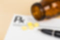 vecteezy_medicine-on-blank-prescription-form-with-pen-focus-on-pill_7144173.jpg