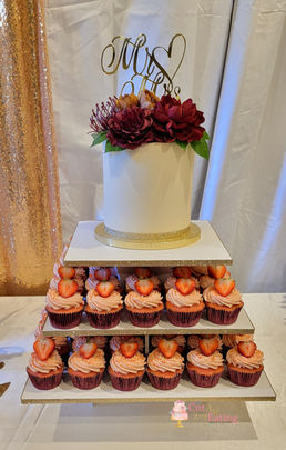 Micro wedding cake with a cupcake tower.  Cupcake and Cake flavor was strawberry crunch.