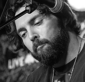 Brett Emmers, Founder of Plus 3 Golf, laughing during a conversation on Parker Diffie's podcast