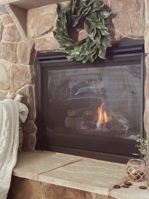 Medium size magnolia wreath over fireplace from The Gifted Wreath