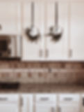 Decorate your kitchen cabinet door with beautiful Christmas hoop wreaths with black velvet ribbon
