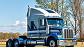 a semi truck outdoors , colors should match my website of blues and greys.jpg