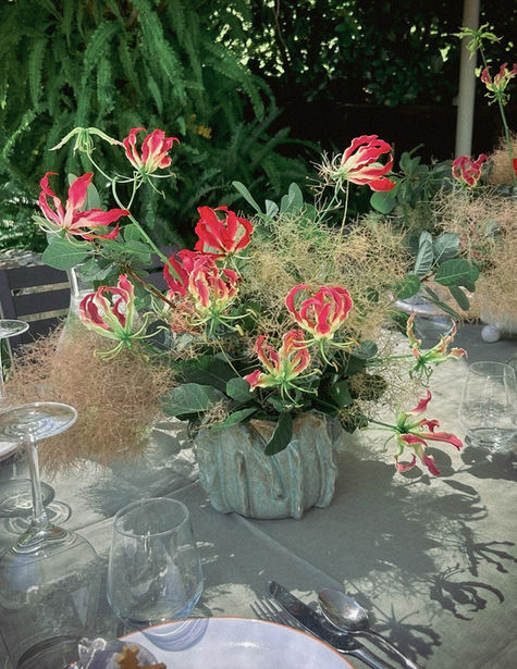 Event flowers with gloriosa and smokebush