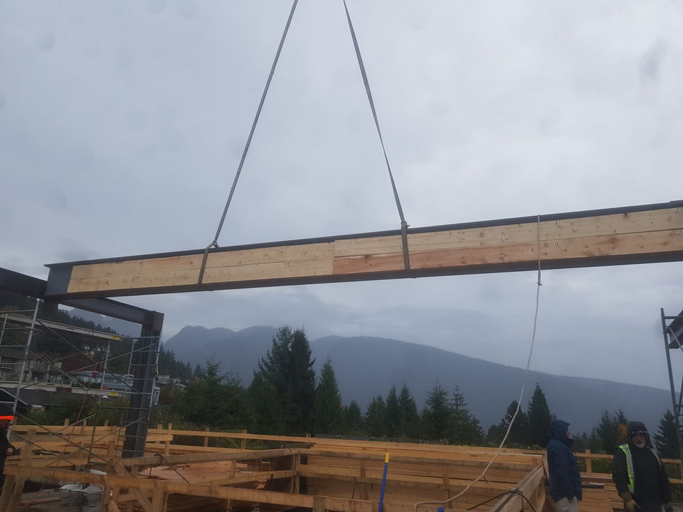 Structural steel connection work during mansion framing stage