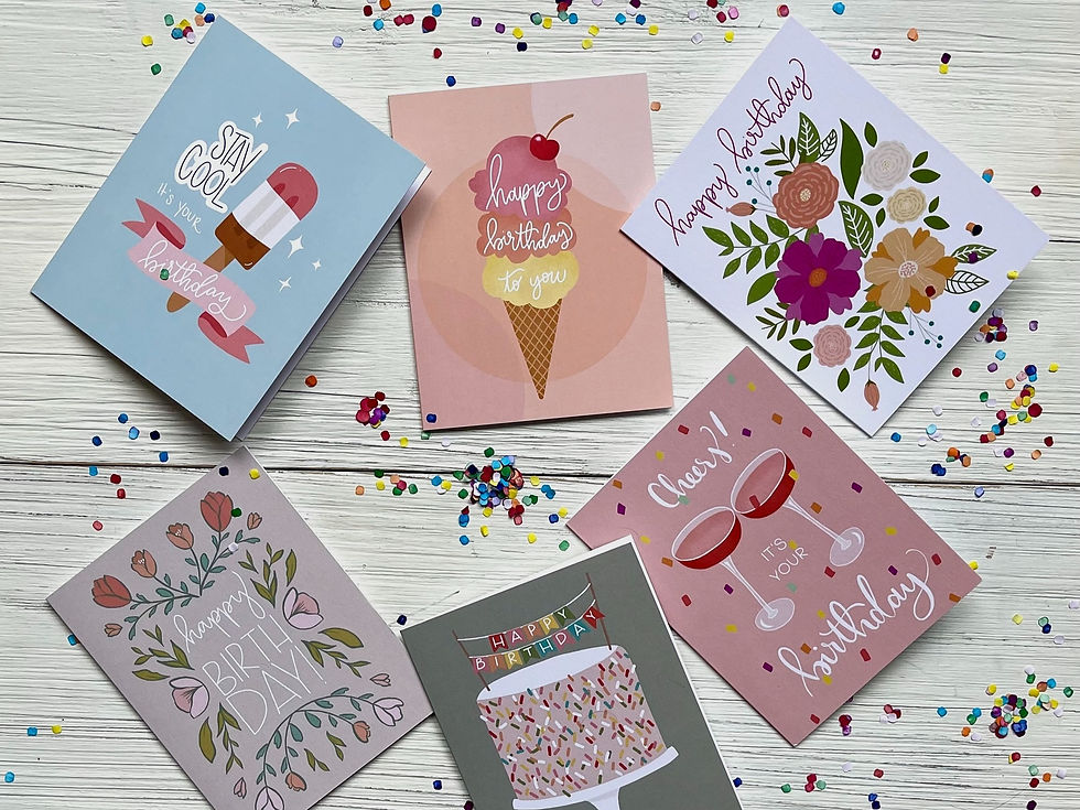 Assortment of greeting cards surrounded with confetti.