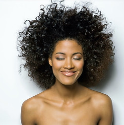 Portrait of a Smiling Woman with Curly Hair_edited.jpg