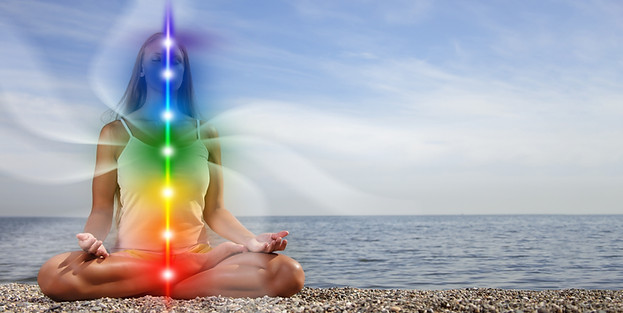 Yoga meditation outdoors. Glowing seven all chakra. Woman sits in a Upward Salute pose on