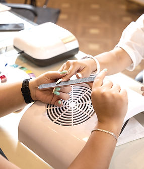 Closeup shot of a woman in a nail salon