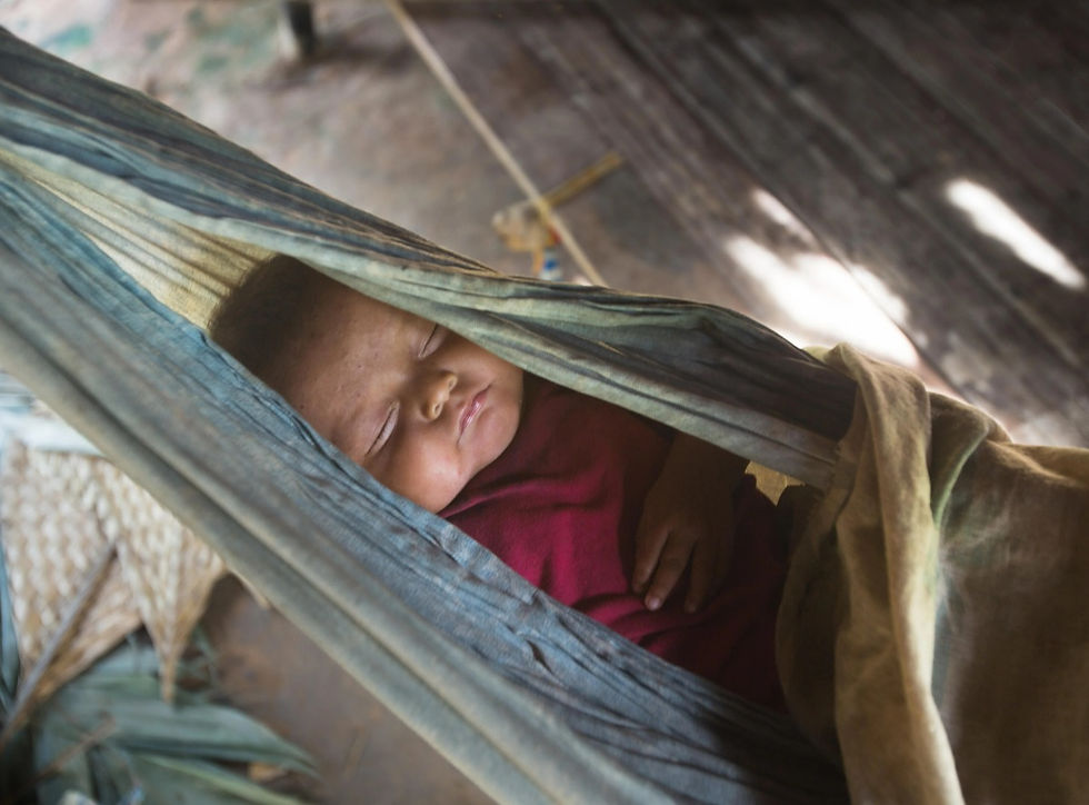 Baby sleeping in a hammock in the Tsimané settlement of Anachere, in the Amazon rainforest