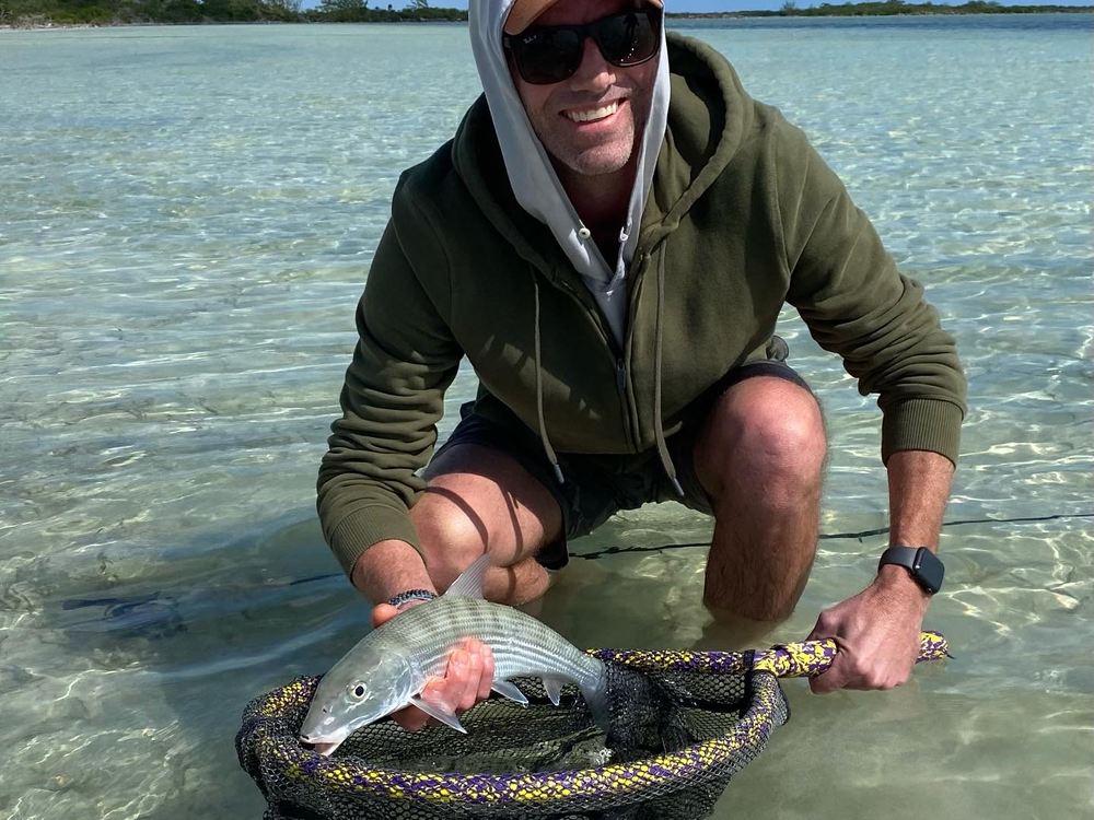 Bonefish held in a net before release