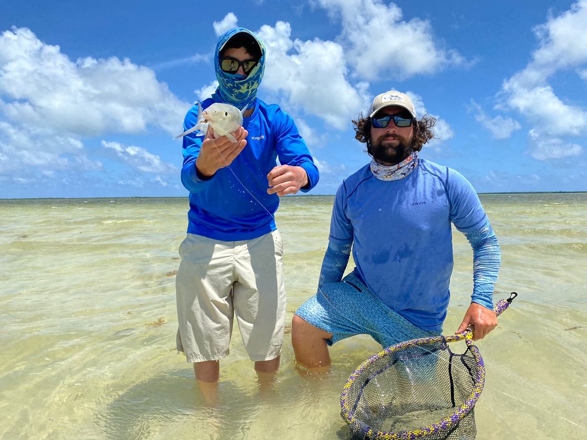 Guide and angler together on a Belize flat