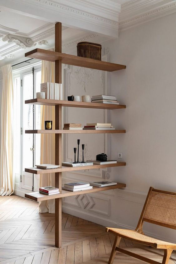 Modern room divider that serves as bookcase and items display.