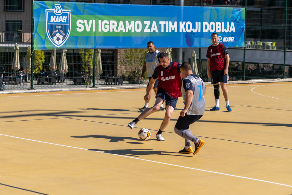 Team building photography - Football match during construction industry team building event