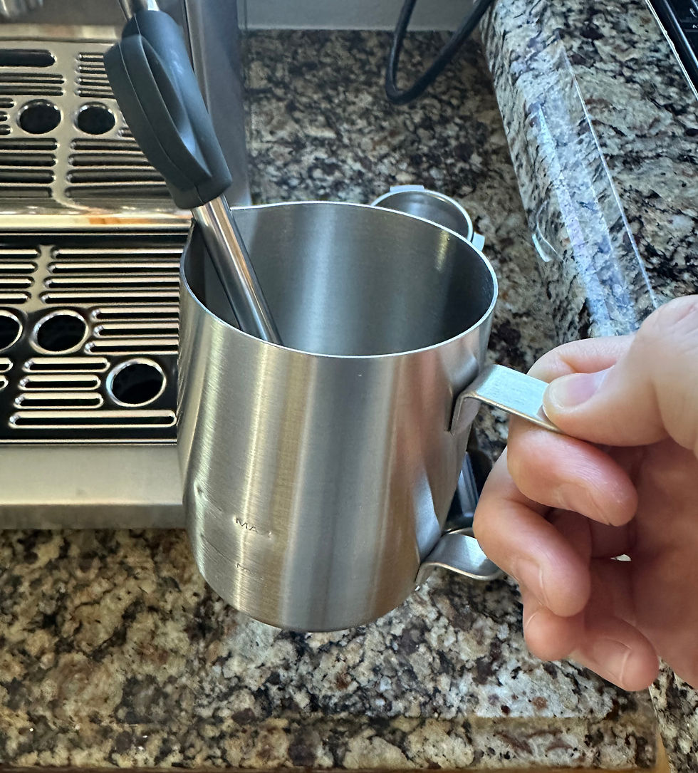 Steaming Milk In Milk Jug