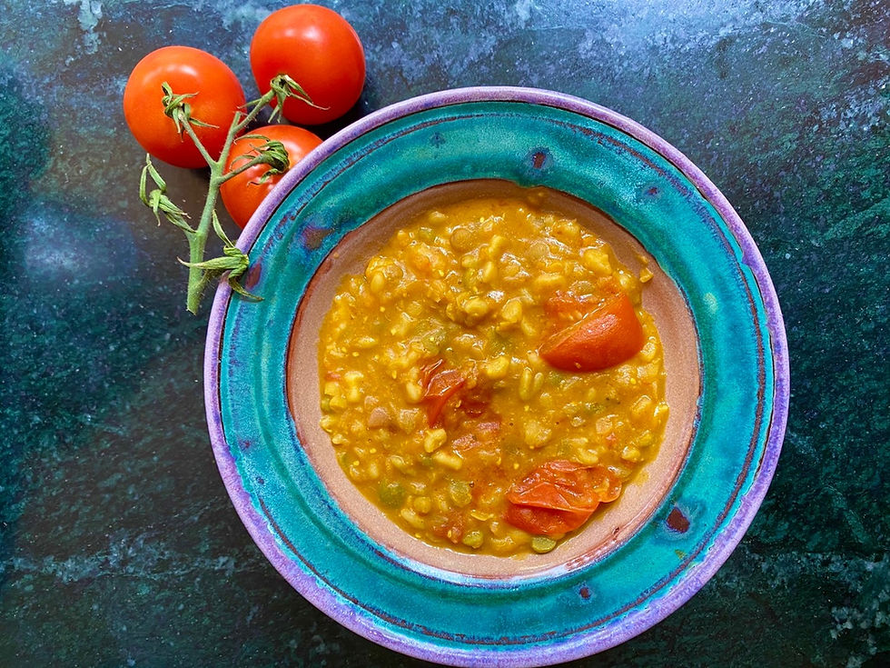Curried Lentils in bowl with tomatoes