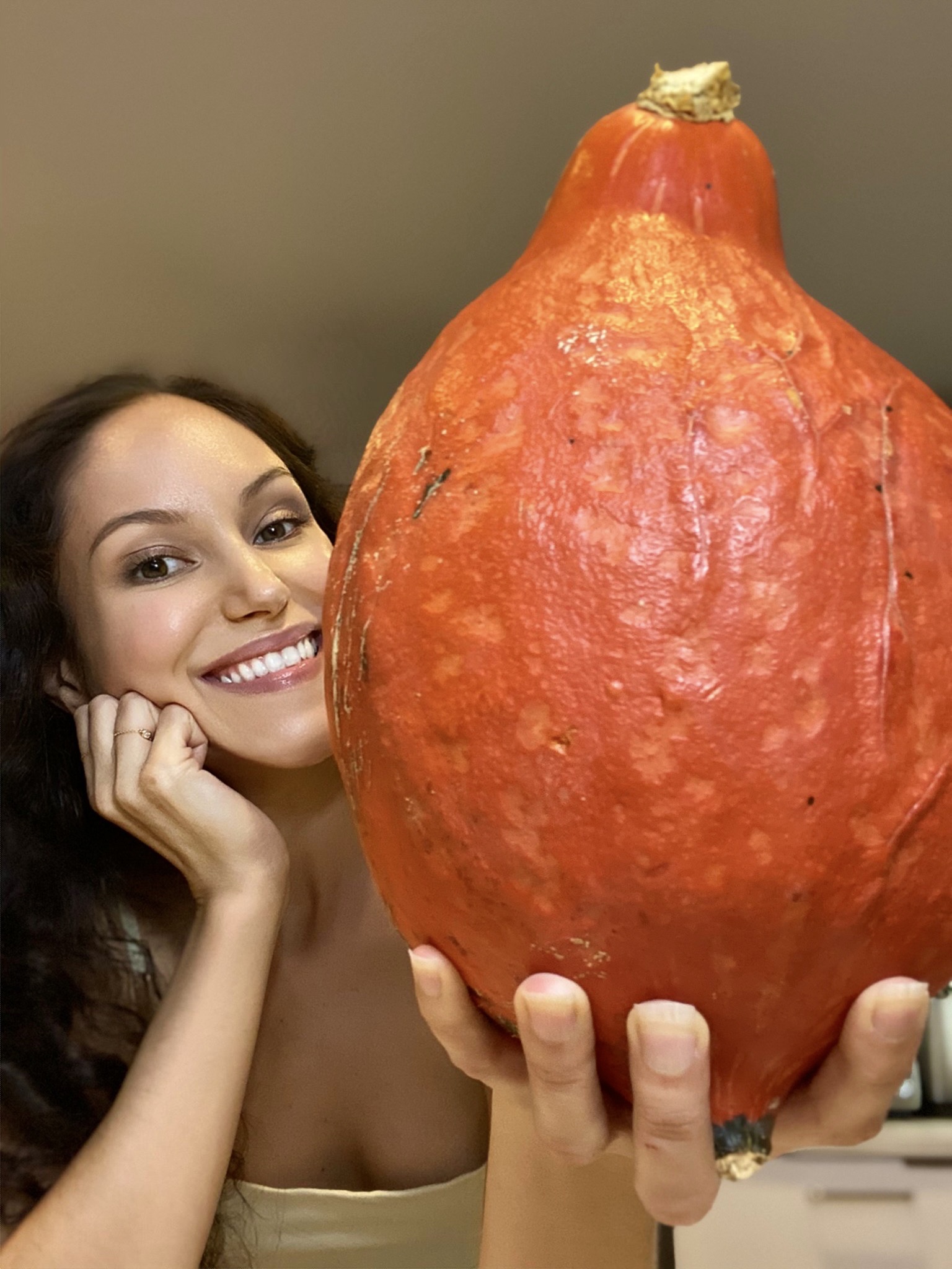 food blogger holding a giant squash