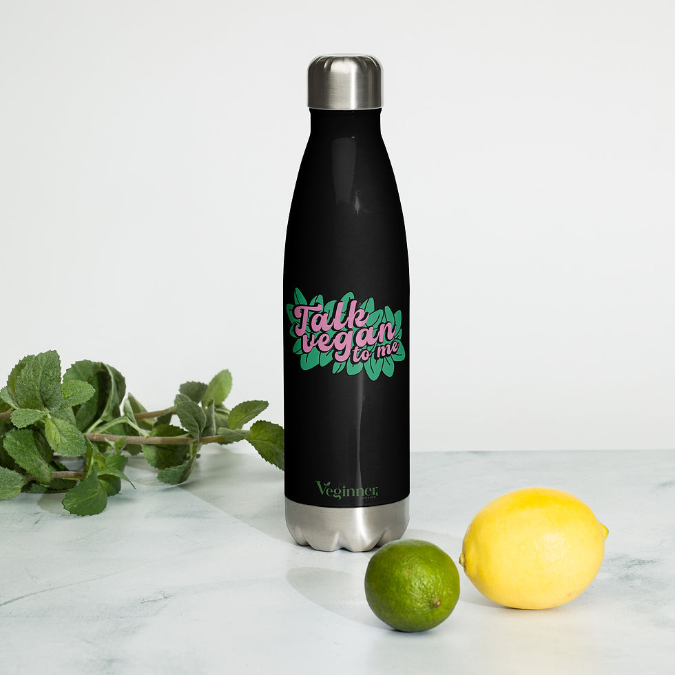 Thumbnail: Black stainless steel bottle with Talk Vegan To Me print resting next to lemons, shown on minimalist white background
