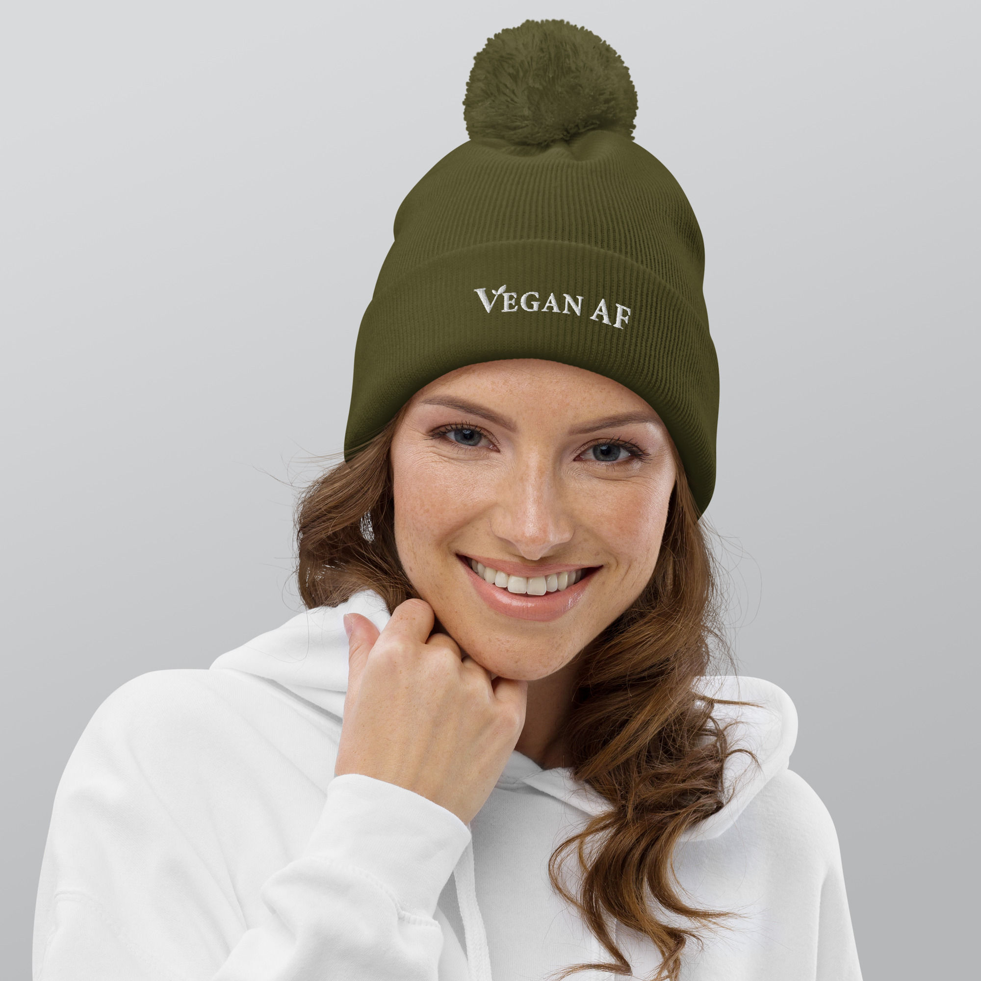 Model wearing Vegan pom pom beanie