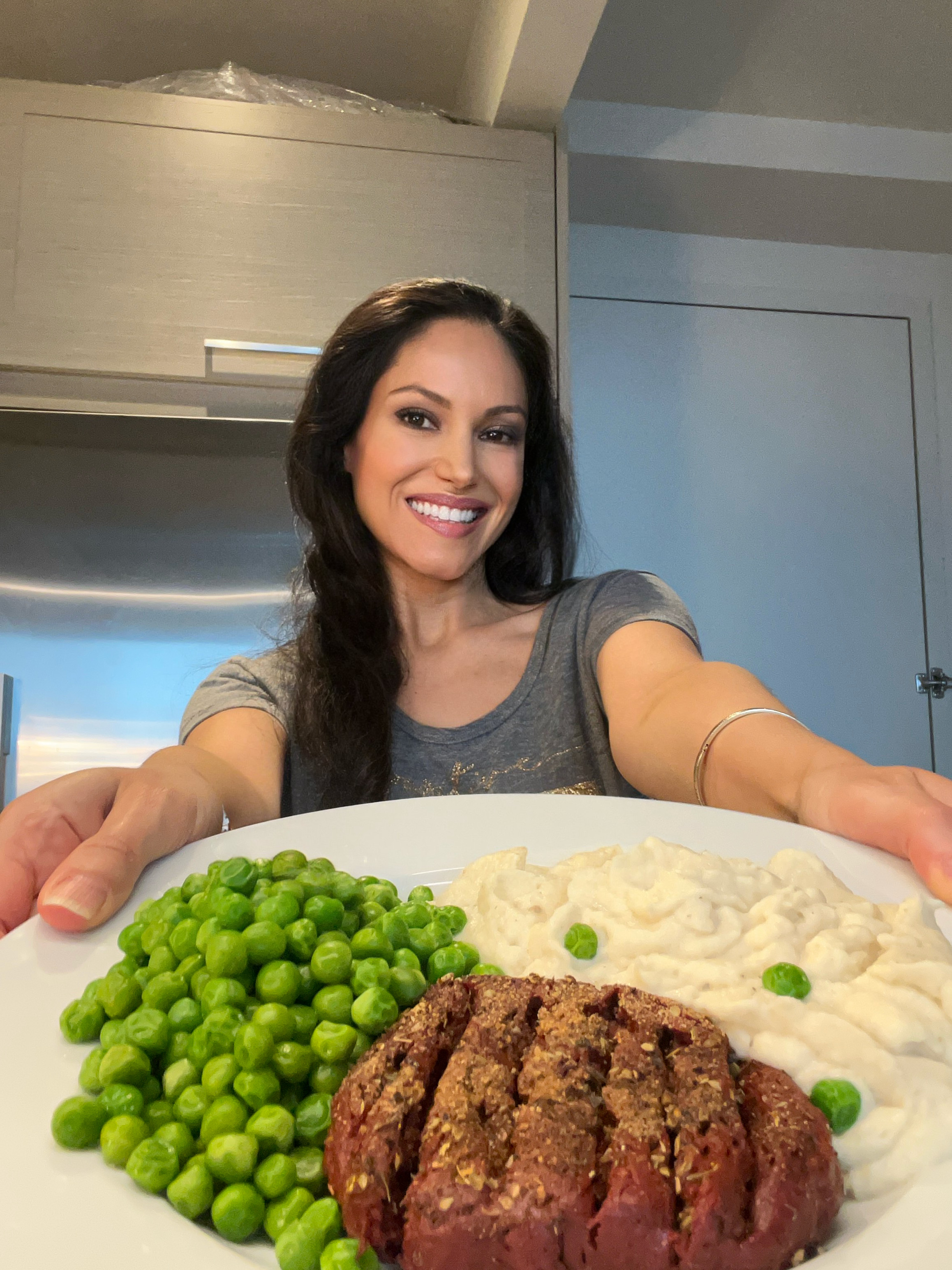 vegan blogger holding a plate of vegan food