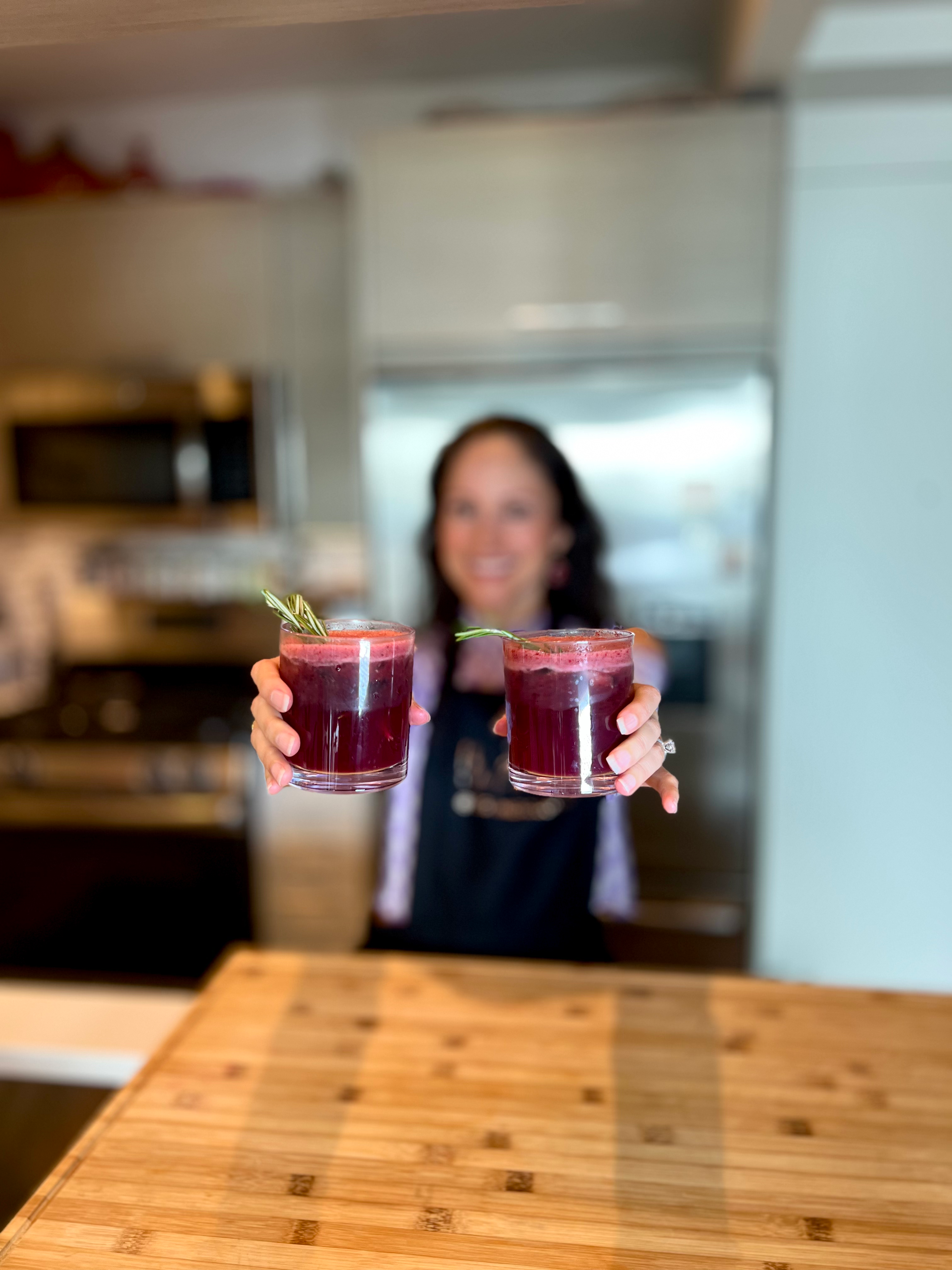 woman holding mocktails