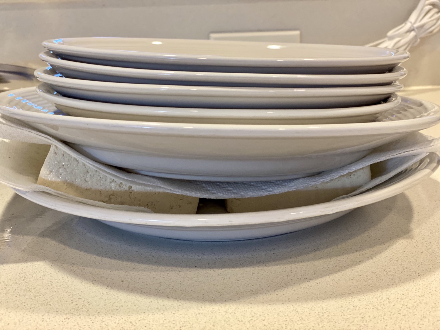Tofu underneath plates