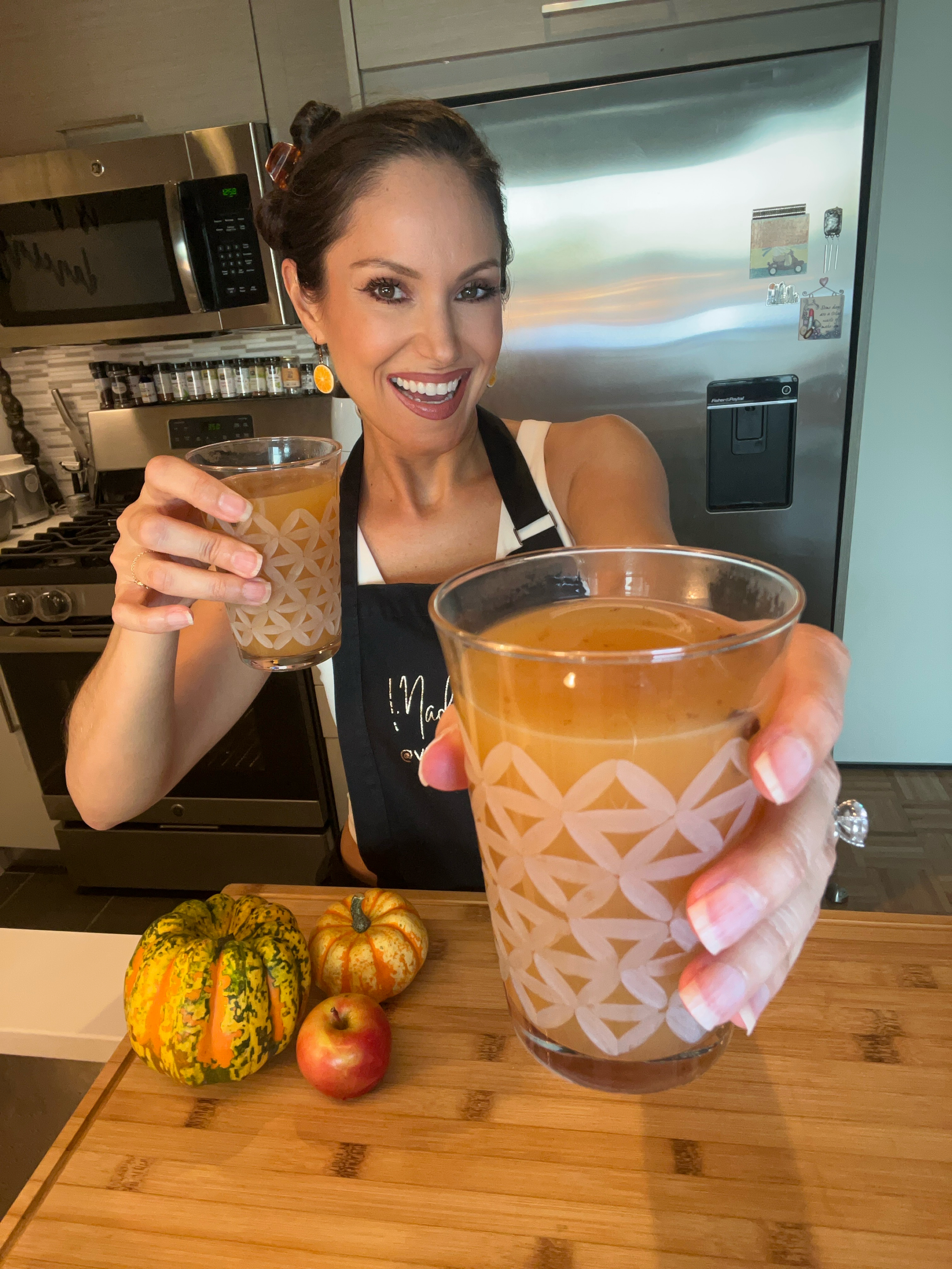vegan blogger holding apple cider