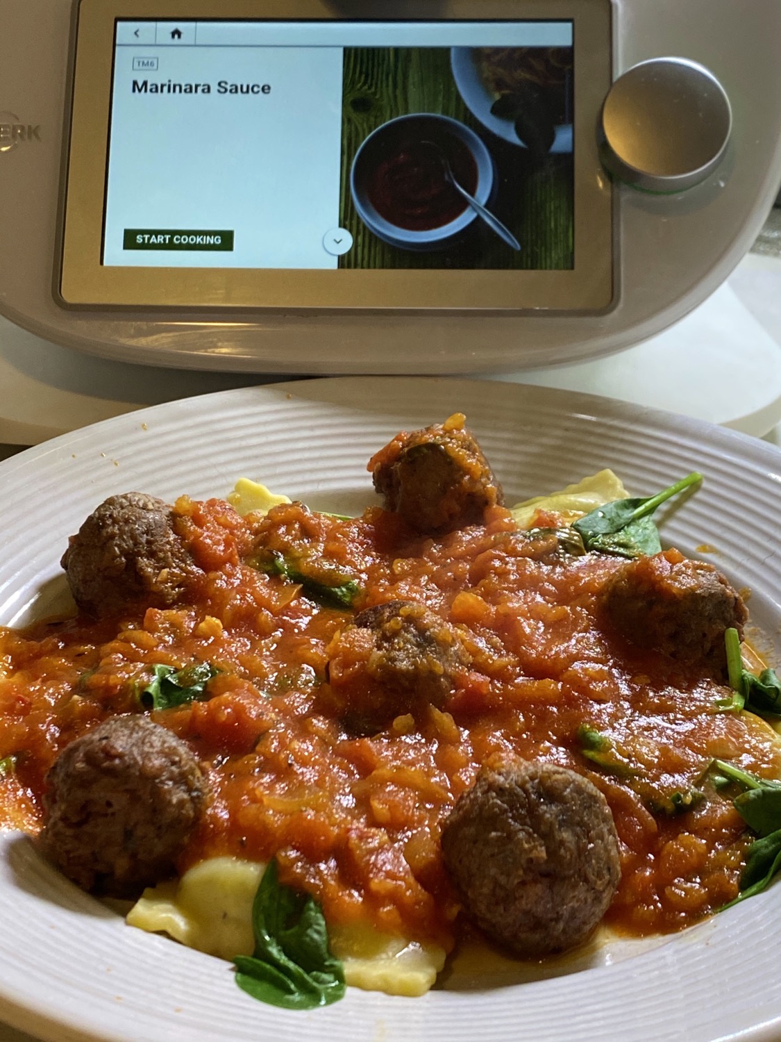 Vegan Meatball Marinara on plate next to recipe
