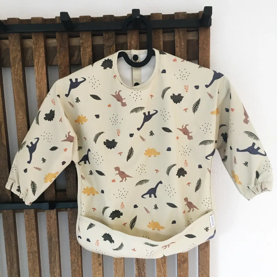 Bavoir plastifié à manches 1 à 3 ans Liewood - Dinosaures
