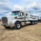 Dump truck and trailer loaded with sand and gravel