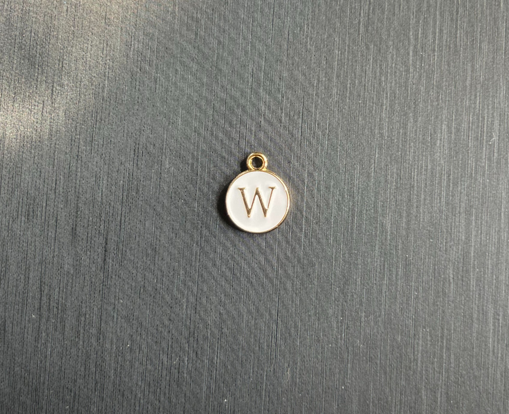 The White Circle "W" Charm