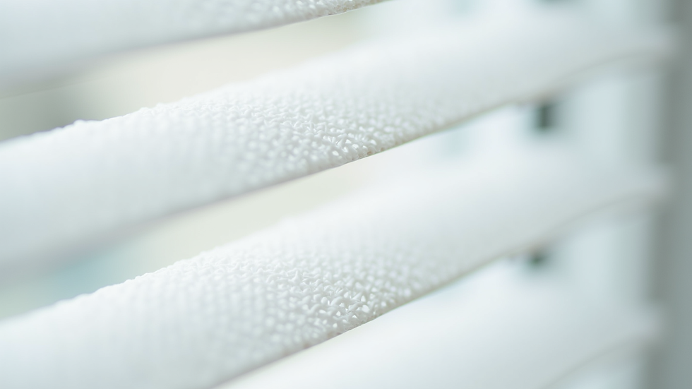 Close-up view of white cellular blinds showing honeycomb structure