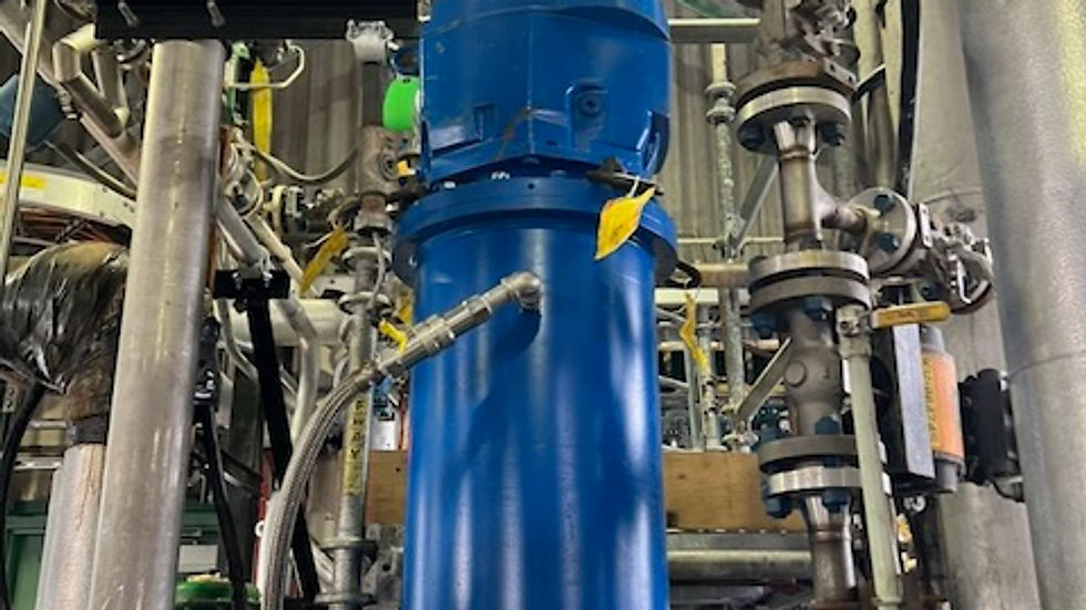 Close-up view of a magnetic drive mixer installed in an industrial chemical processing plant