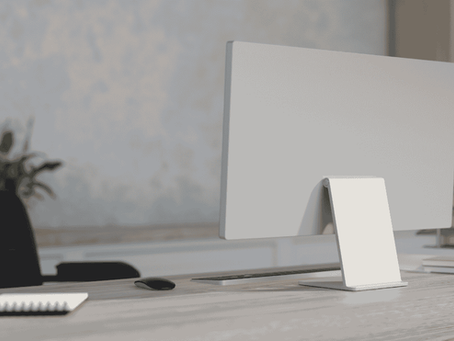 Minimal workspace with laptop and notebook on a modern startup office desk