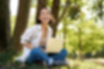 portrait-asian-girl-with-laptop-sitting-near-tree-park-sunny-summer-day-working-remote-e_e