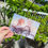 Thumbnail: hand holding beidou ningguang postcard