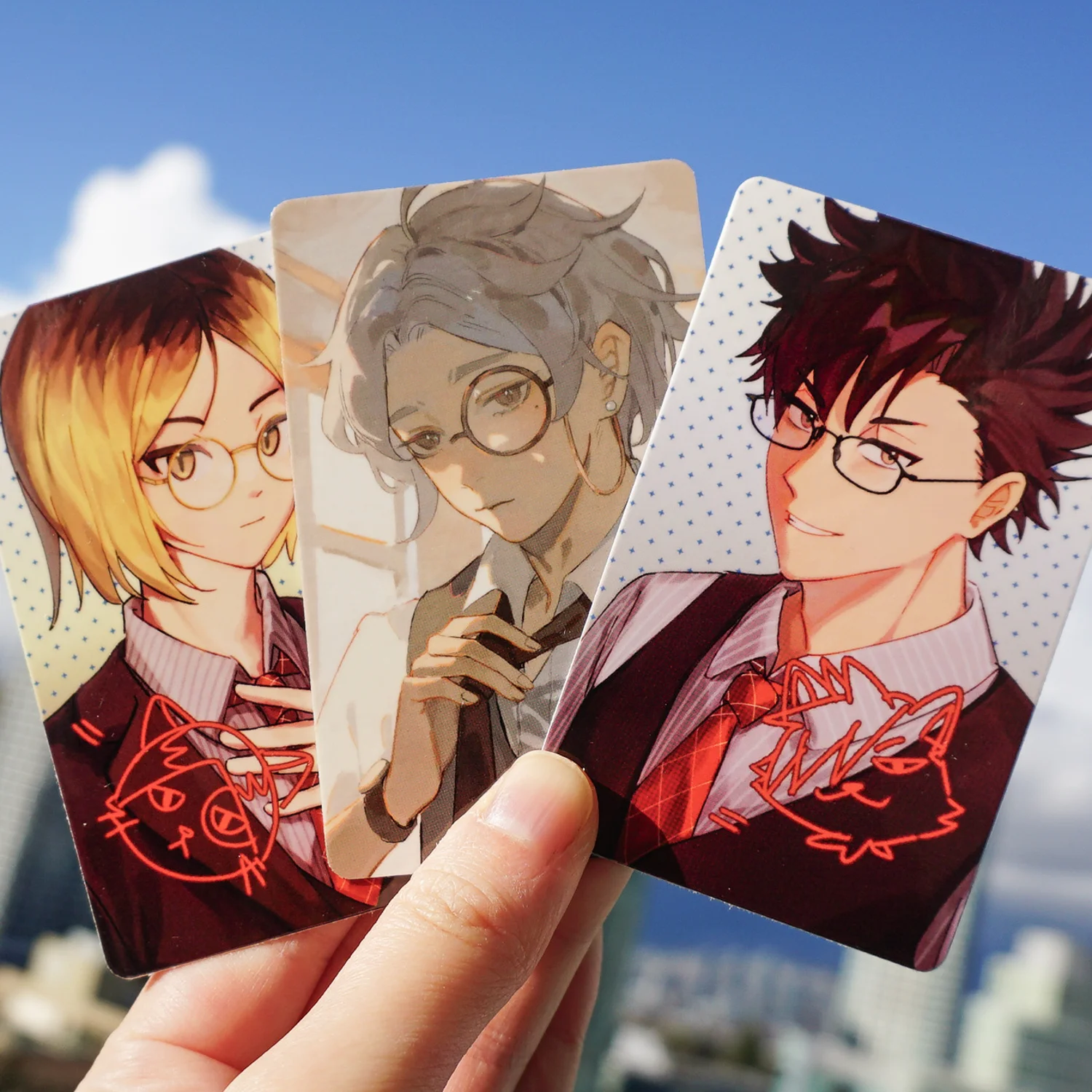 photocards of kenma, kuroo and suga in suits with glasses