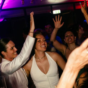 Professional wedding dancers building energy before the DJ starts