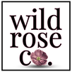 Square Wild Rose Co. logo with bold text, pink outlines, and a central mauve rose.