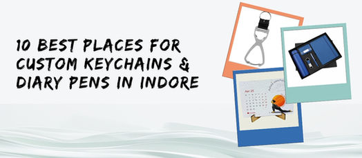 Text "10 Best Places for Custom Keychains & Diary Pens in Indore" with images of a keychain, a calendar, and a set with a pen on a wavy background.