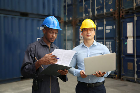 manager-and-dock-worker-under-discussion-about-dock-container-shipping-warehouse-document-
