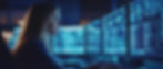 woman-focused-computer-screens-with-data-code.jpg