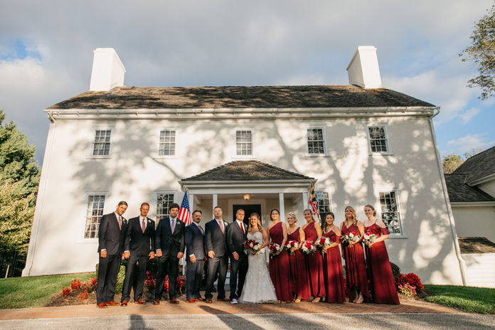 A bridal party portrait in front of Historic Waverly Mansion