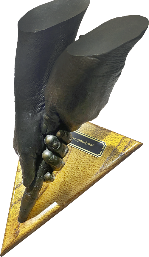 A cast of Moe Norman's hands on a golf club (right side)