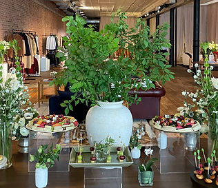 Grazing display with cheese, fruit and greenery at a boutique event