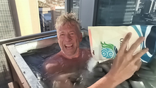 Seager in ice bath pours mineral salts from white plastic bag