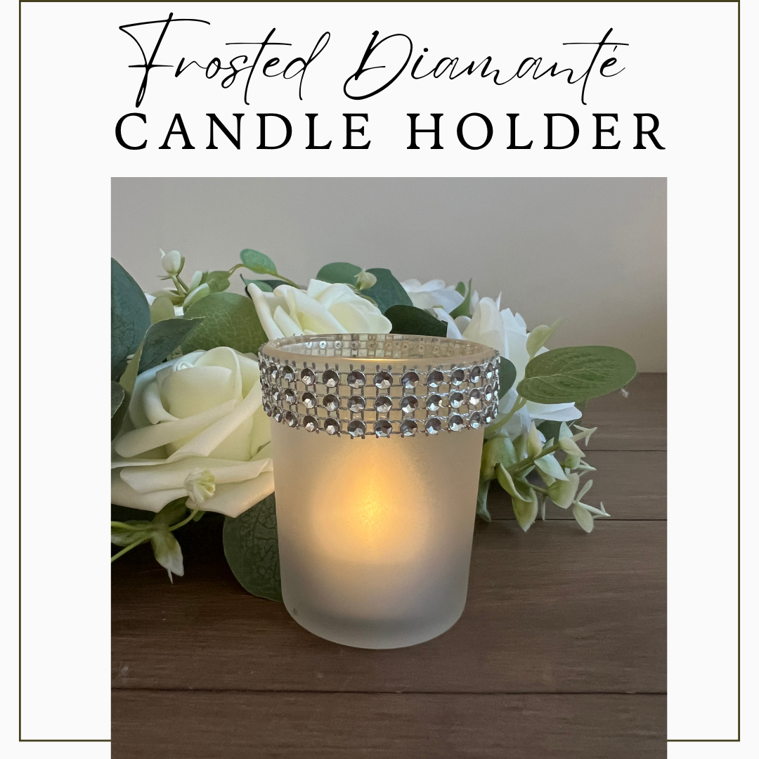 Elegant frosted candle holder with a sparkling diamanté band, illuminated by a soft LED tealight candle.