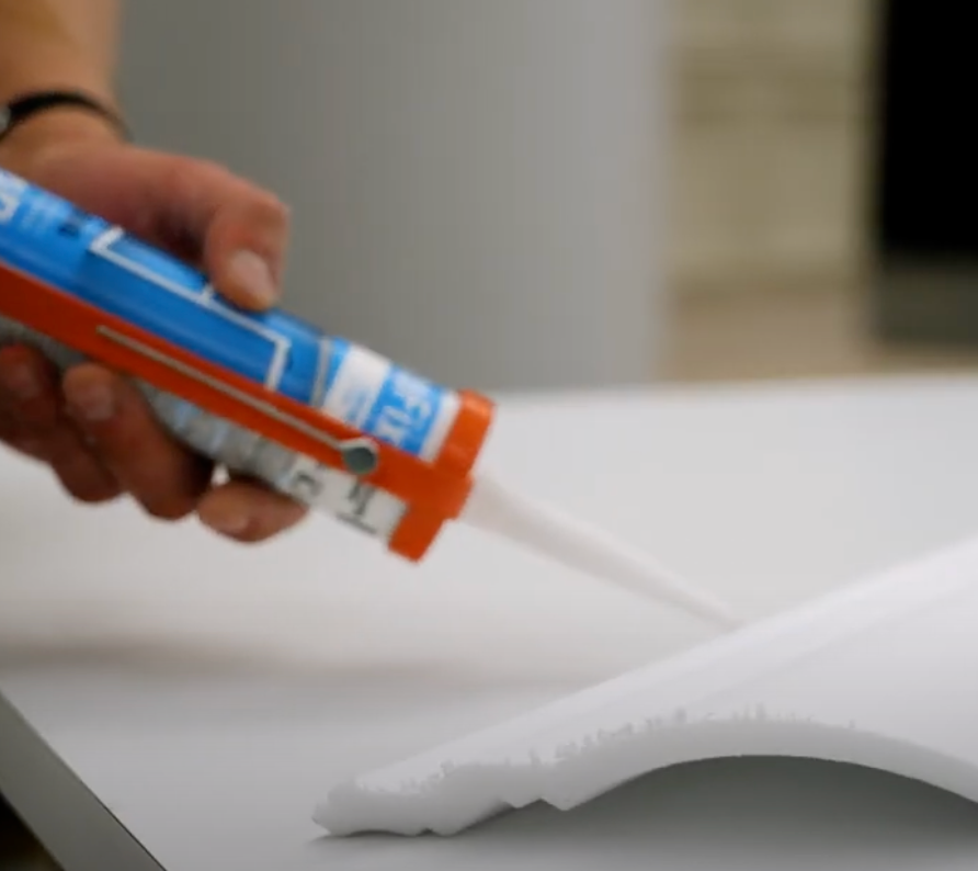High angle view of tools and decorative ceiling profiles ready for installation