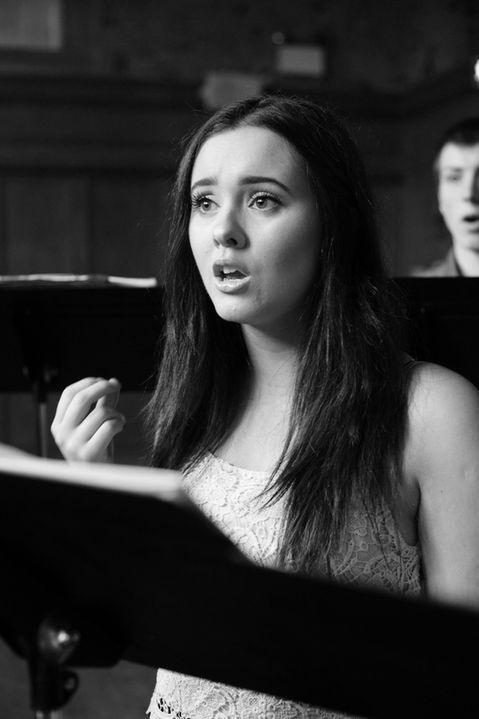 A black and white photo of a solo performer