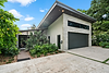 Modern Farmington Residence exterior with sloped roof and garage.