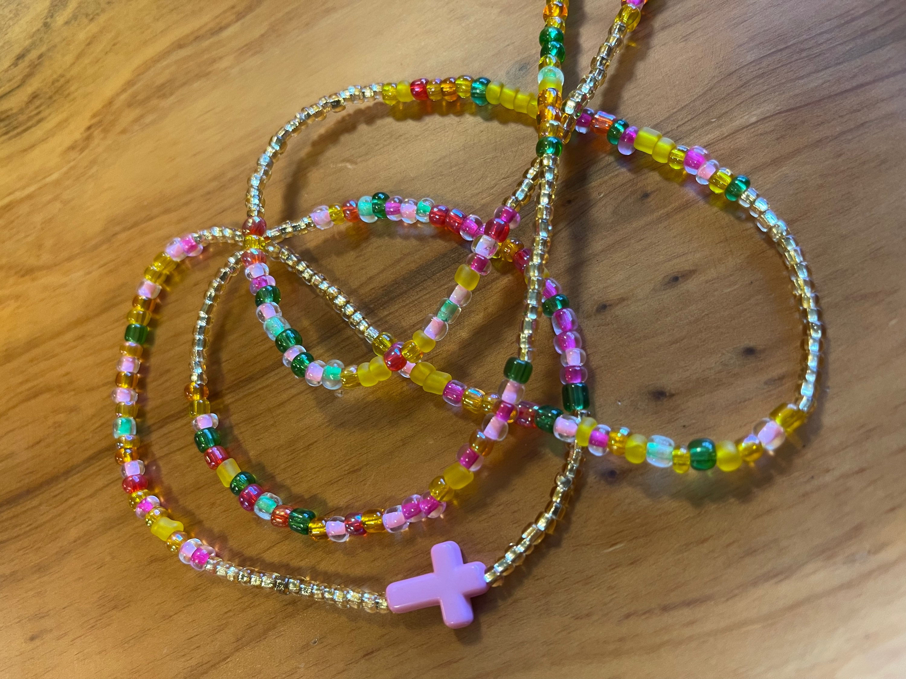 Pink, green, yellow, and gold mix with cross 